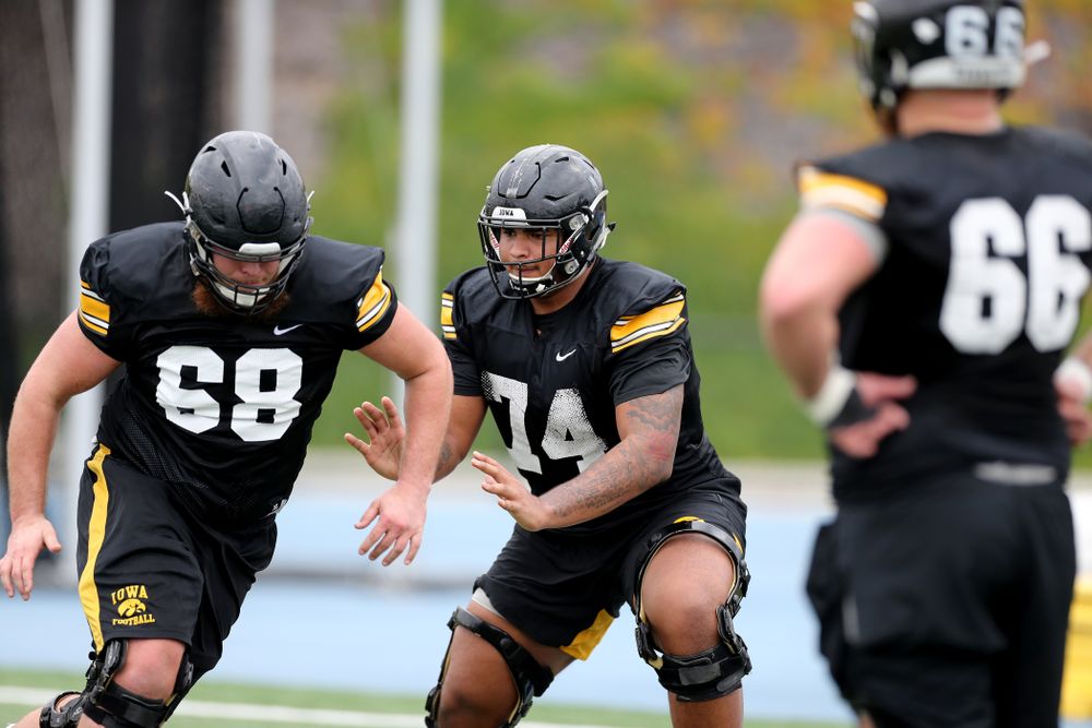Iowa Hawkeyes offensive lineman Tristan Wirfs (74) works a drill with offensive lineman Landan Paulsen (68) during practice Sunday, December 22, 2019 at Mesa College in San Diego. (Brian Ray/hawkeyesports.com)