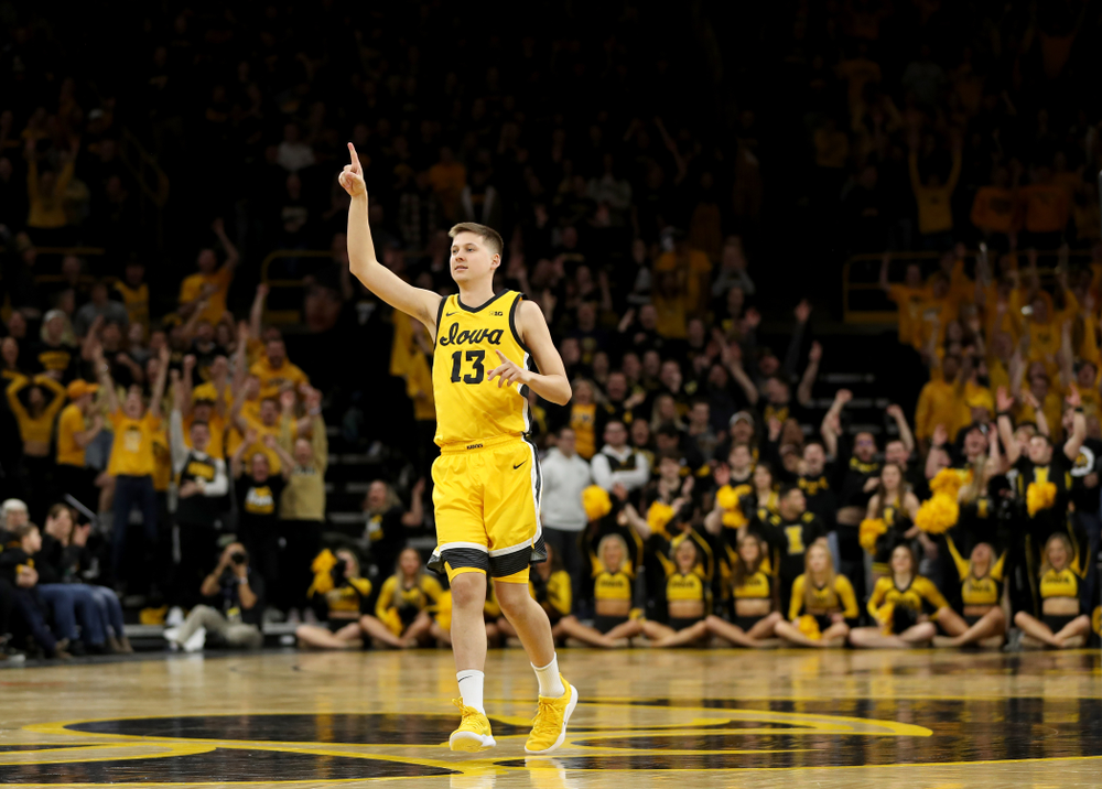 Iowa Hawkeyes guard Austin Ash (13) celebrates a three point basket against the Nebraska Cornhuskers Saturday, February 8, 2020 at Carver-Hawkeye Arena. (Brian Ray/hawkeyesports.com)