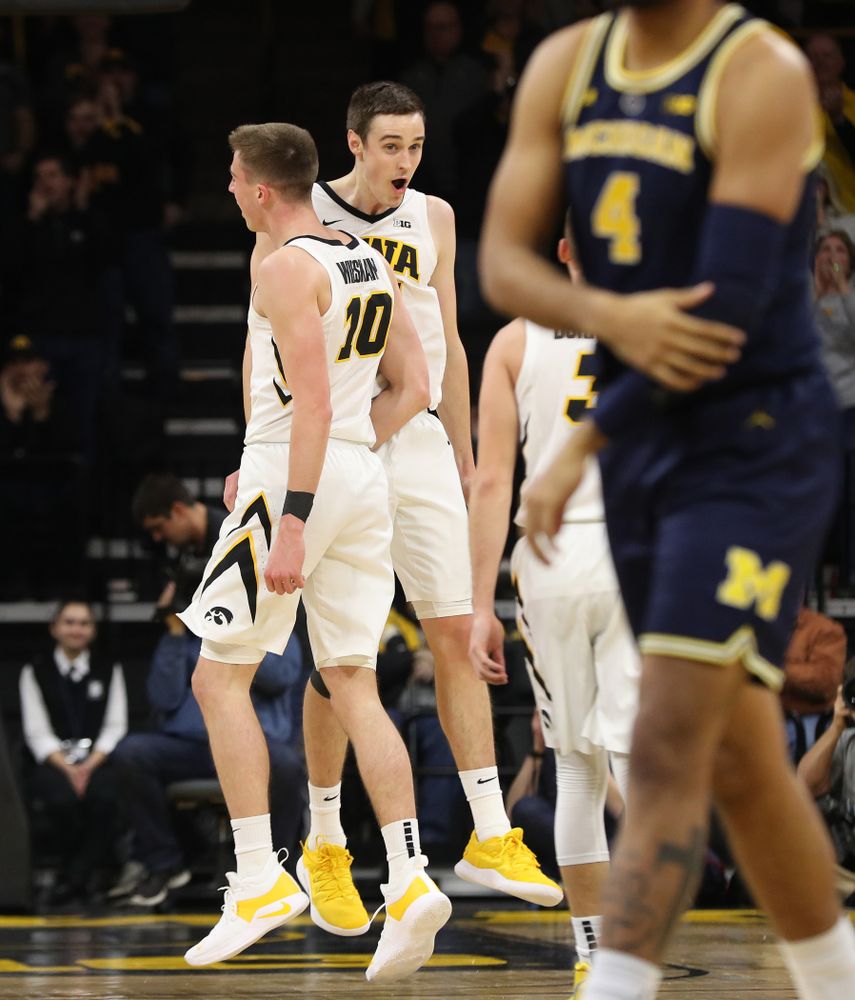 Iowa Hawkeyes guard Joe Wieskamp (10) and forward Nicholas Baer (51) against the Michigan Wolverines Friday, February 1, 2019 at Carver-Hawkeye Arena. (Brian Ray/hawkeyesports.com)