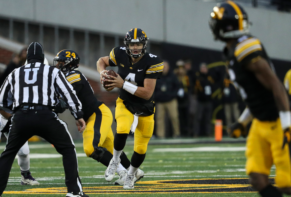 Iowa Hawkeyes quarterback Nate Stanley (4) scrambles in the pocket during a game against Northwestern at Kinnick Stadium on November 10, 2018. (Tork Mason/hawkeyesports.com)
