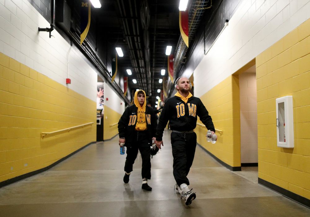 Iowa Alex Marinelli and Austin DeSanto walk to the mat for their meet against WisconsinÕs Sunday, December 1, 2019 at Carver-Hawkeye Arena.