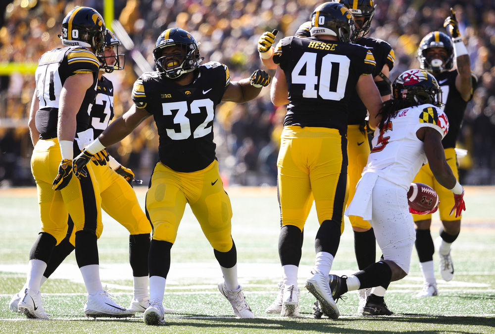 Iowa Hawkeyes linebacker Djimon Colbert (32) reacts after Iowa Hawkeyes defensive end Parker Hesse (40) makes a tackle for loss during a game against Maryland at Kinnick Stadium on October 20, 2018. (Tork Mason/hawkeyesports.com)