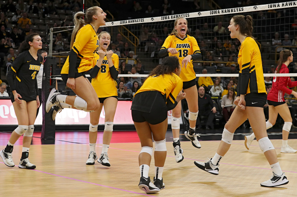 Iowa’s Halle Johnston (4), Maddie Slagle (15), Kyndra Hansen (8), Brie Orr (7), Hannah Clayton (18), and Courtney Buzzerio (2) celebrate a score during their match at Carver-Hawkeye Arena in Iowa City on Sunday, Oct 20, 2019. (Stephen Mally/hawkeyesports.com)