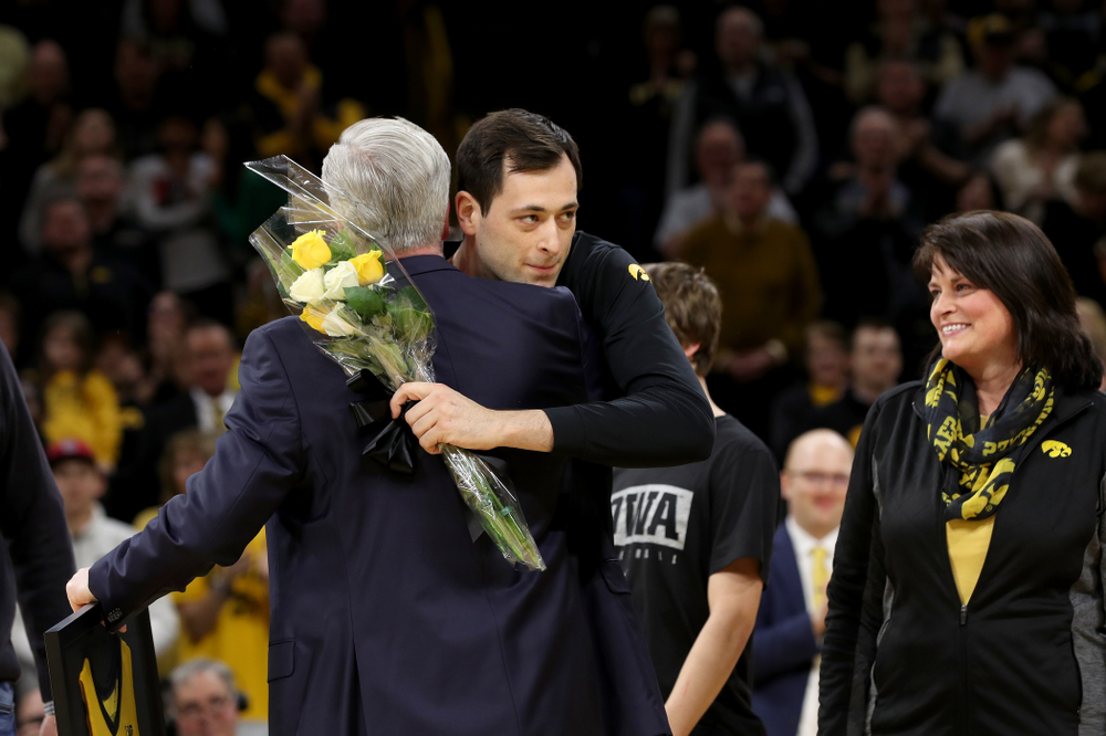 Iowa Hawkeyes forward Ryan Kriener (15) hold up his jersey during senior night activities before their game against the Purdue Boilermakers Tuesday, March 3, 2020 at Carver-Hawkeye Arena. (Brian Ray/hawkeyesports.com)