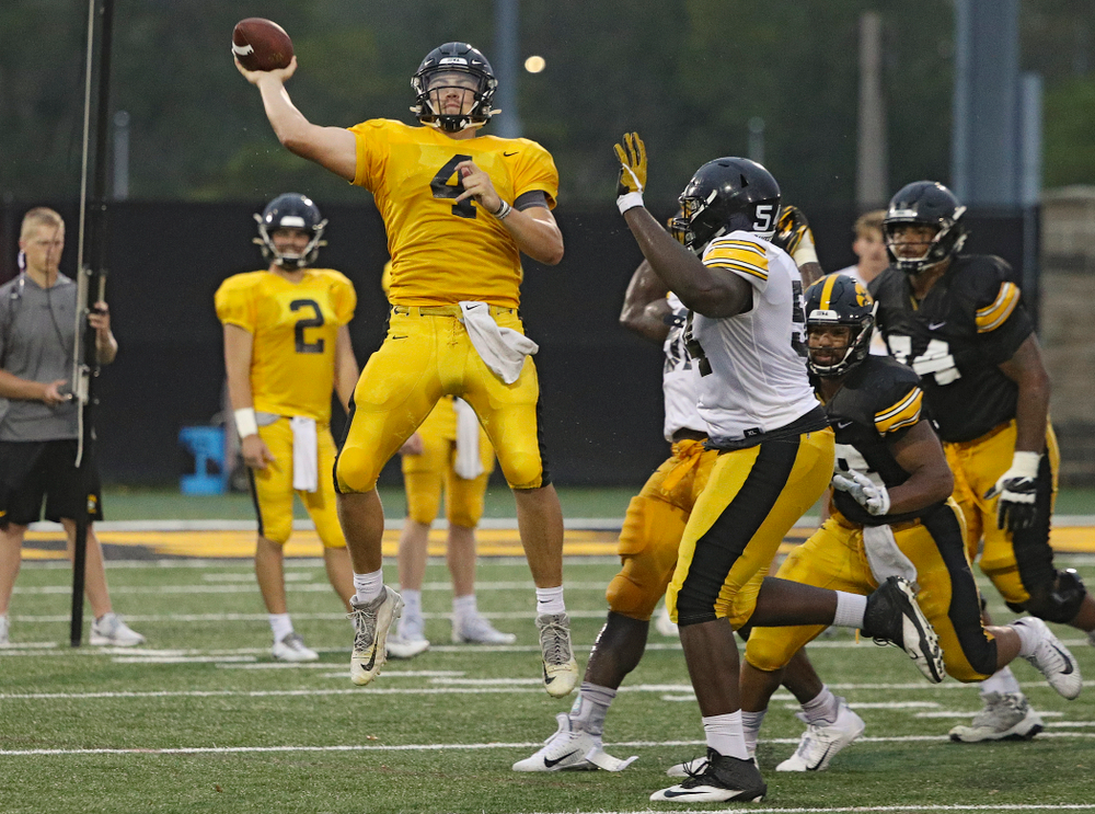Iowa Hawkeyes quarterback Nate Stanley (4) throws while on the run durning Fall Camp Practice No. 17 at the Hansen Football Performance Center in Iowa City on Wednesday, Aug 21, 2019. (Stephen Mally/hawkeyesports.com)