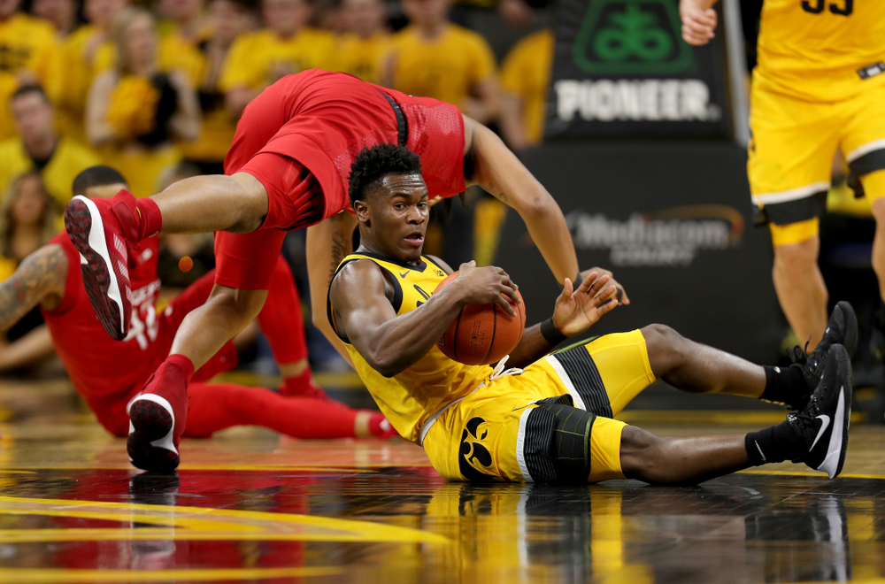 Iowa Hawkeyes guard Joe Toussaint (1) collects a loose ball against the Rutgers Scarlet Knights Wednesday, January 22, 2020 at Carver-Hawkeye Arena. (Brian Ray/hawkeyesports.com)