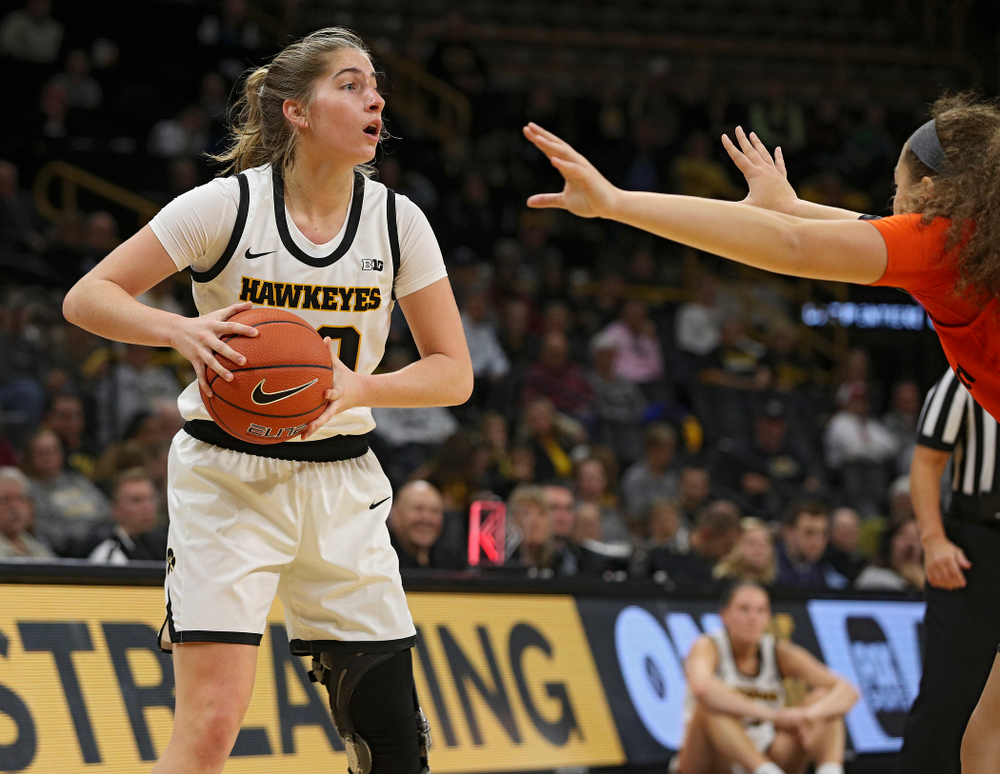 Iowa guard Kate Martin (20) looks to pass during the first quarter of their overtime win against Princeton at Carver-Hawkeye Arena in Iowa City on Wednesday, Nov 20, 2019. (Stephen Mally/hawkeyesports.com)