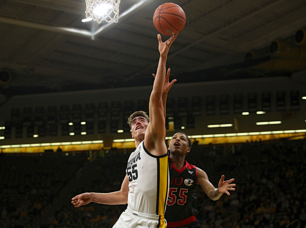 Iowa Hawkeyes center Luka Garza (55) puts up a shot during the first half of their game at Carver-Hawkeye Arena in Iowa City on Friday, Nov 8, 2019. (Stephen Mally/hawkeyesports.com)