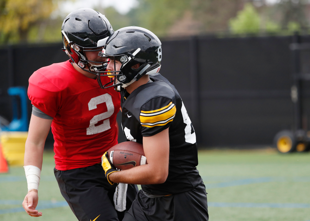 Iowa Hawkeyes wide receiver Nico Ragaini (89) and quarterback Peyton Mansell (2) during practice No. 4 of Fall Camp Monday, August 6, 2018 at the Hansen Football Performance Center. (Brian Ray/hawkeyesports.com)