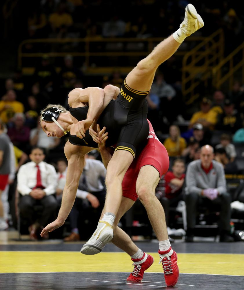 IowaÕs Kaleb Young wrestles WisconsinÕs Garrett Model at 157 pounds Sunday, December 1, 2019 at Carver-Hawkeye Arena. Young won the match 12-6. (Brian Ray/hawkeyesports.com)