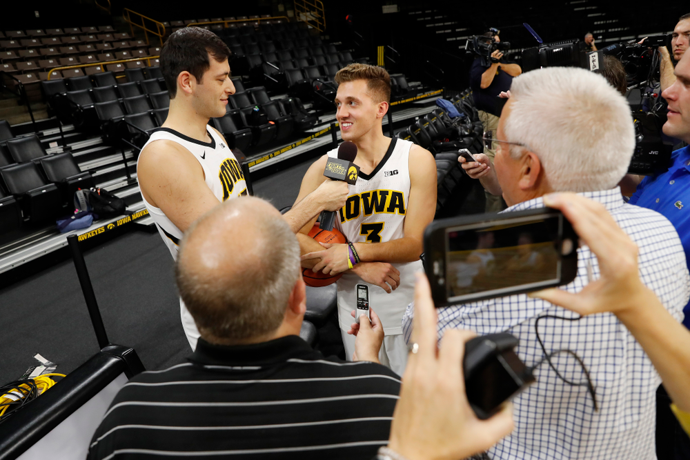 Iowa Hawkeyes forward Ryan Kriener (15) and guard Jordan Bohannon (3) during the team's annual media day Monday, October 8, 2018 at Carver-Hawkeye Arena. (Brian Ray/hawkeyesports.com)