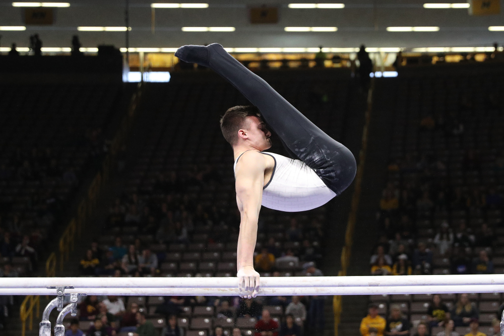 Iowa's Mitch Mandozzi competes on the parallel bars against UIC and Minnesota Saturday, February 2, 2019 at Carver-Hawkeye Arena. (Brian Ray/hawkeyesports.com)