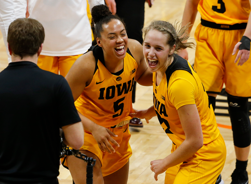 Iowa Hawkeyes guard Alexis Sevillian (5) and Iowa Hawkeyes guard Kathleen Doyle (22) celebrate after a game against the Ohio State Buckeyes at Carver-Hawkeye Arena on January 25, 2018. (Tork Mason/hawkeyesports.com)