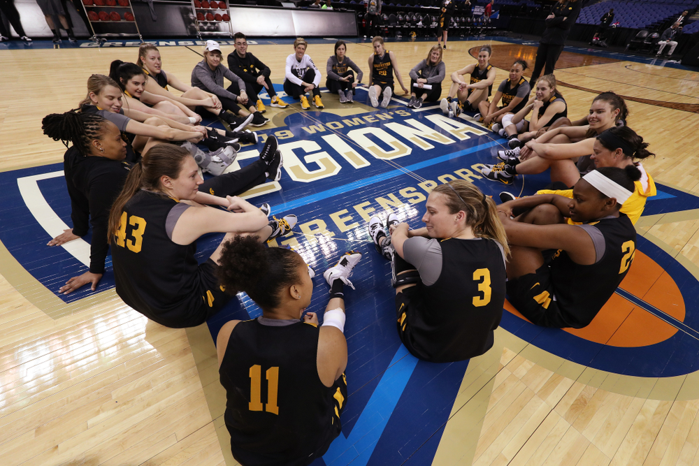 The Iowa Hawkeyes talk in their circle at the end of shoot around before their game against the NC State Wolfpack in the regional semi-final of the 2019 NCAA Women's College Basketball Tournament Saturday, March 30, 2019 at Greensboro Coliseum in Greensboro, NC.(Brian Ray/hawkeyesports.com)