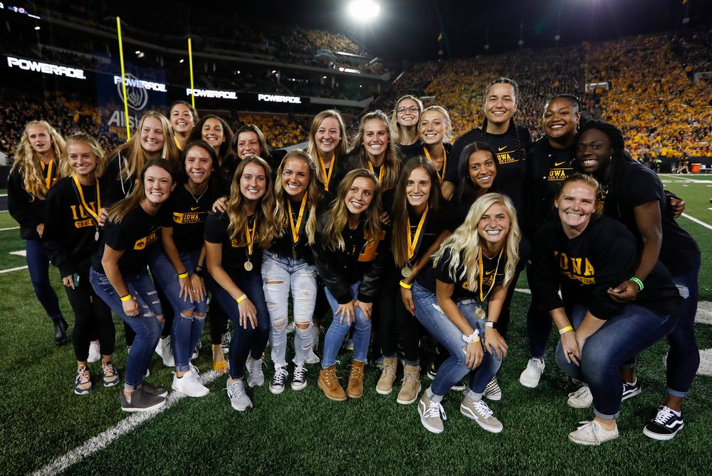 Members of the Iowa women's track and field team are recognized by the Presidential Committee on Athletics at halftime during a game against Wisconsin on September 22, 2018. (Tork Mason/hawkeyesports.com)