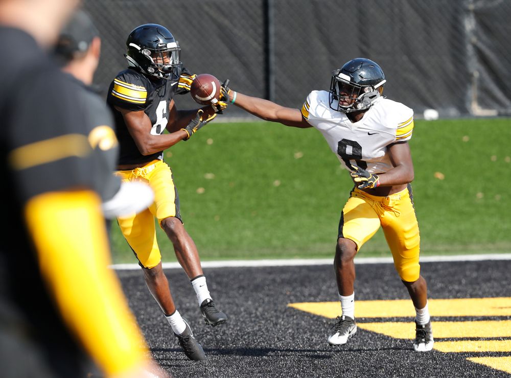 Iowa Hawkeyes wide receiver Ihmir Smith-Marsette (6) and defensive back Matt Hankins (8) during camp practice No. 17 Wednesday, August 22, 2018 at the Kenyon Football Practice Facility. (Brian Ray/hawkeyesports.com)