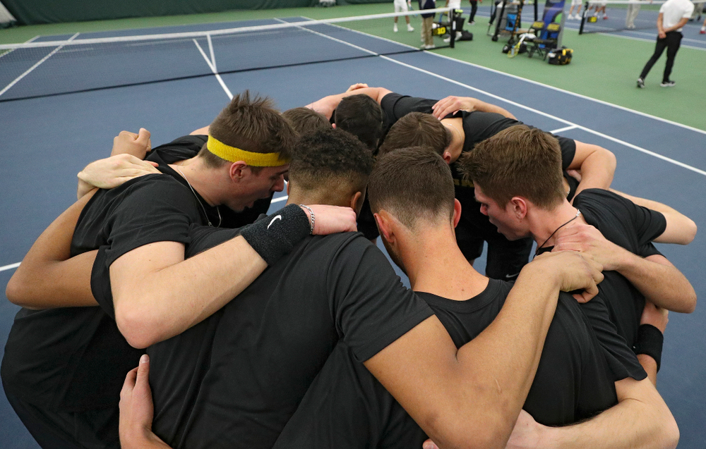 The Hawkeyes huddle before their match at the Hawkeye Tennis and Recreation Complex in Iowa City on Thursday, January 16, 2020. (Stephen Mally/hawkeyesports.com)