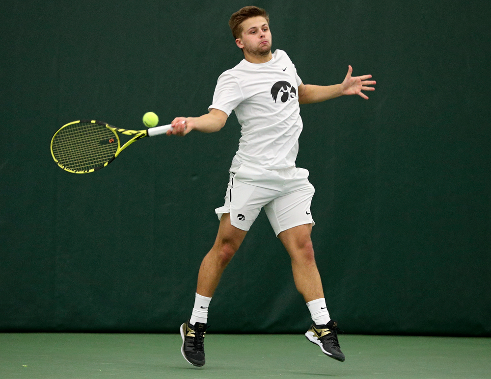 Iowa’s Will Davies returns a shot during his singles match at the Hawkeye Tennis and Recreation Complex in Iowa City on Sunday, February 16, 2020. (Stephen Mally/hawkeyesports.com)