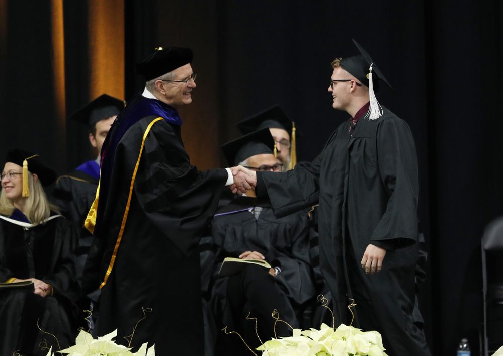 Iowa Men's Basketball manager Lucas Pauley during the Fall Commencement Ceremony Saturday, December 15, 2018 at Carver-Hawkeye Arena. (Brian Ray/hawkeyesports.com)