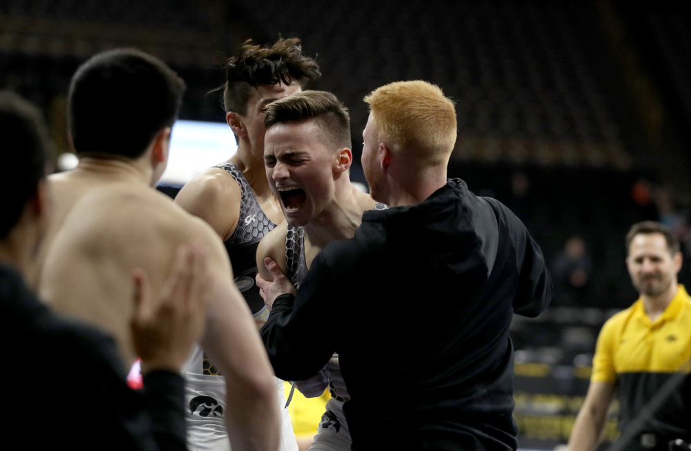 Iowa’s Mitch Mandozzi competes on the high bar against Illinois Sunday, March 1, 2020 at Carver-Hawkeye Arena. (Brian Ray/hawkeyesports.com)