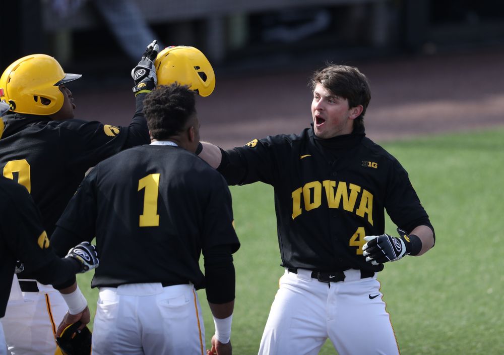 Iowa Hawkeyes infielder Mitchell Boe (4) reacts after hitting a game tying three-run homer against California State Northridge Sunday, March 17, 2019 at Duane Banks Field. (Brian Ray/hawkeyesports.com)