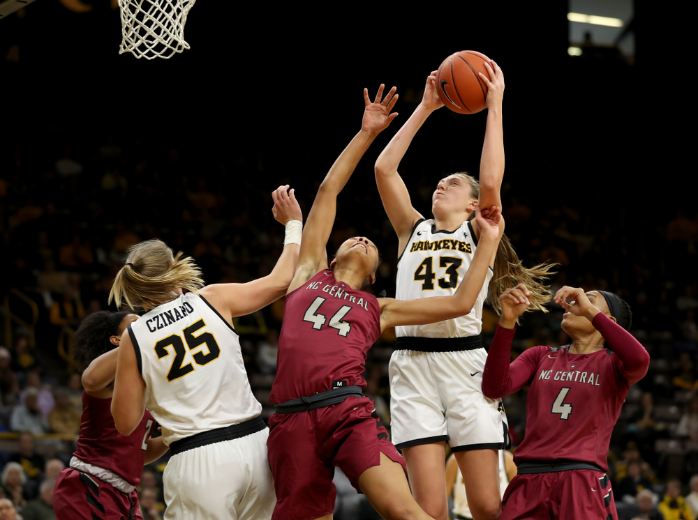 Iowa Hawkeyes forward Amanda Ollinger (43) grabs a rebound against North Carolina Central Saturday, December 14, 2019 at Carver-Hawkeye Arena. (Brian Ray/hawkeyesports.com)