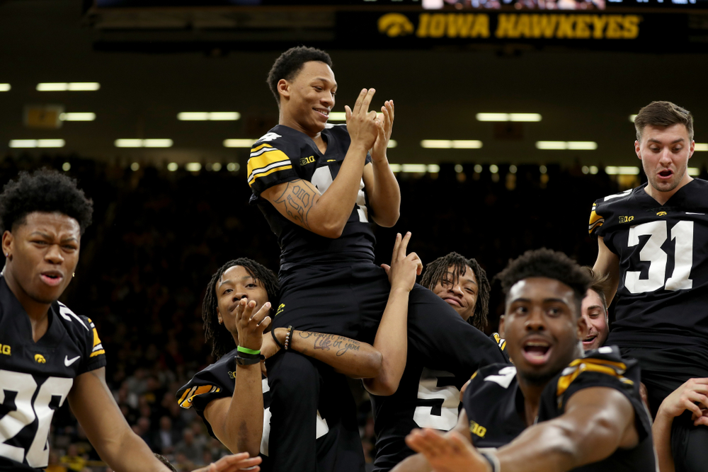 Members of the Hawkeye Football team performs with the Iowa Dance Team at halftime of the Iowa Hawkeyes game against the Ohio State Buckeyes Thursday, February 20, 2020 at Carver-Hawkeye Arena. (Brian Ray/hawkeyesports.com)