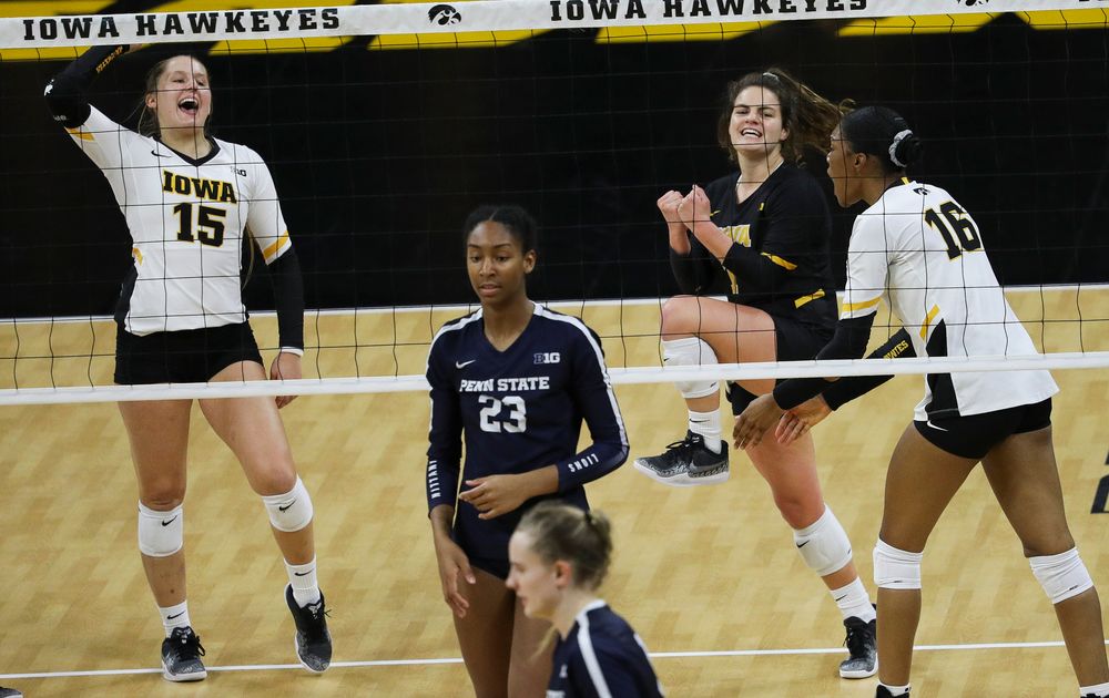 Iowa Hawkeyes defensive specialist Maddie Slagle (15) and Iowa Hawkeyes defensive specialist Molly Kelly (1) celebrate after winning a point during a match against Penn State at Carver-Hawkeye Arena on November 3, 2018. (Tork Mason/hawkeyesports.com)