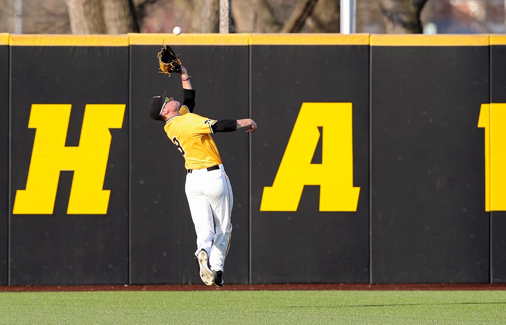 Iowa Hawkeyes center fielder Ben Norman (9) makes a catch on the run for an out during the seventh inning of their game against Northern Illinois at Duane Banks Field in Iowa City on Tuesday, Apr. 16, 2019. (Stephen Mally/hawkeyesports.com)