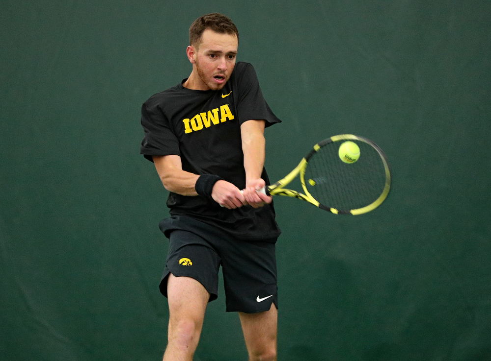 Iowa’s Kareem Allaf returns a shot during their match at the Hawkeye Tennis and Recreation Complex in Iowa City on Thursday, January 16, 2020. (Stephen Mally/hawkeyesports.com)