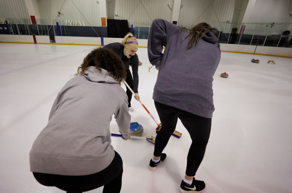 Members of the Iowa Softball team learn the sport of curling as part of a team building event Wednesday, January 10, 2018 at the Cedar Rapids Ice Arena. (Brian Ray/hawkeyesports.com)