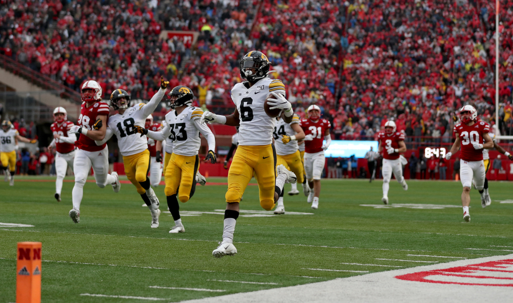 Iowa Hawkeyes wide receiver Ihmir Smith-Marsette (6) returns a kickoff for a touchdown against the Nebraska Cornhuskers Friday, November 29, 2019 at Memorial Stadium in Lincoln, Neb. (Brian Ray/hawkeyesports.com)