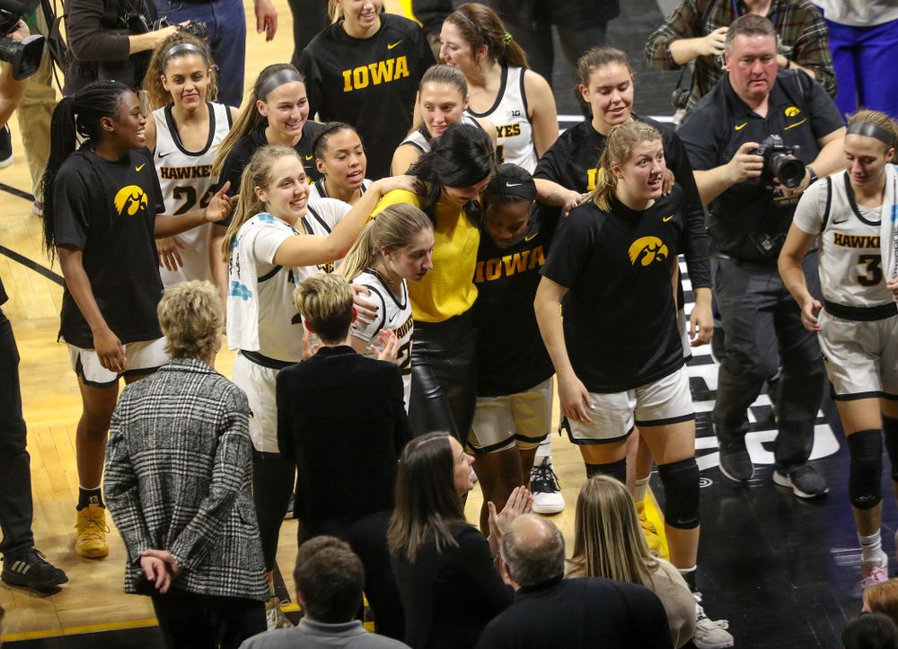 Megan Gustafson walks off the court with the Iowa Hawkeyes after her jersey retirement ceremony at Carver-Hawkeye Arena in Iowa City on Sunday, January 26, 2020. (Stephen Mally/hawkeyesports.com)