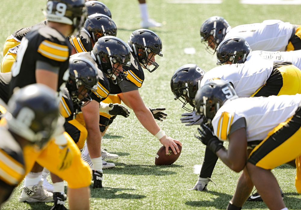 Iowa Hawkeyes offensive lineman Tyler Linderbaum (65) prepares to snap the ball during Fall Camp Practice #5 at the Hansen Football Performance Center in Iowa City on Tuesday, Aug 6, 2019. (Stephen Mally/hawkeyesports.com)