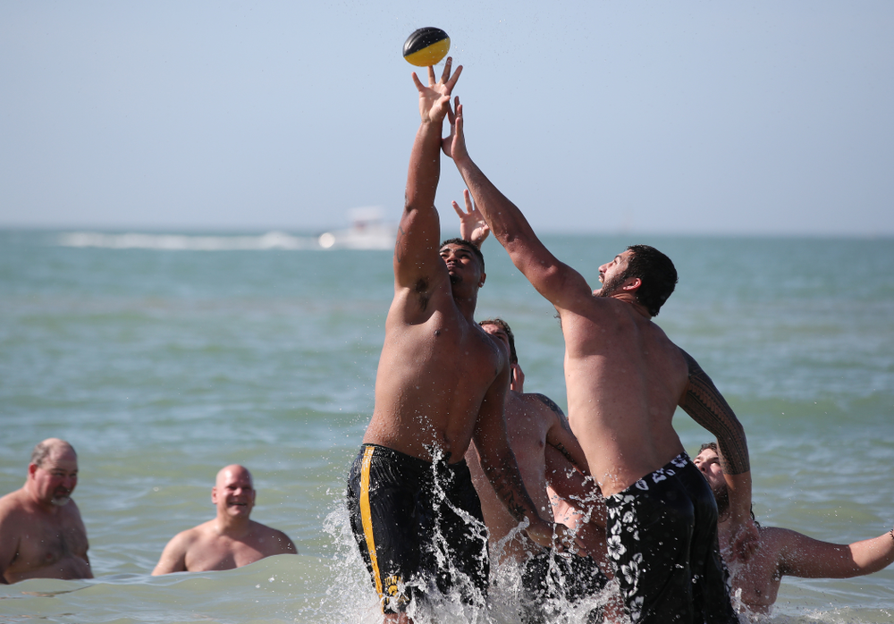 Iowa Hawkeyes offensive lineman Tristan Wirfs (74) and defensive end A.J. Epenesa (94) during the Outback Bowl Beach Day Sunday, December 30, 2018 at Clearwater Beach. (Brian Ray/hawkeyesports.com)