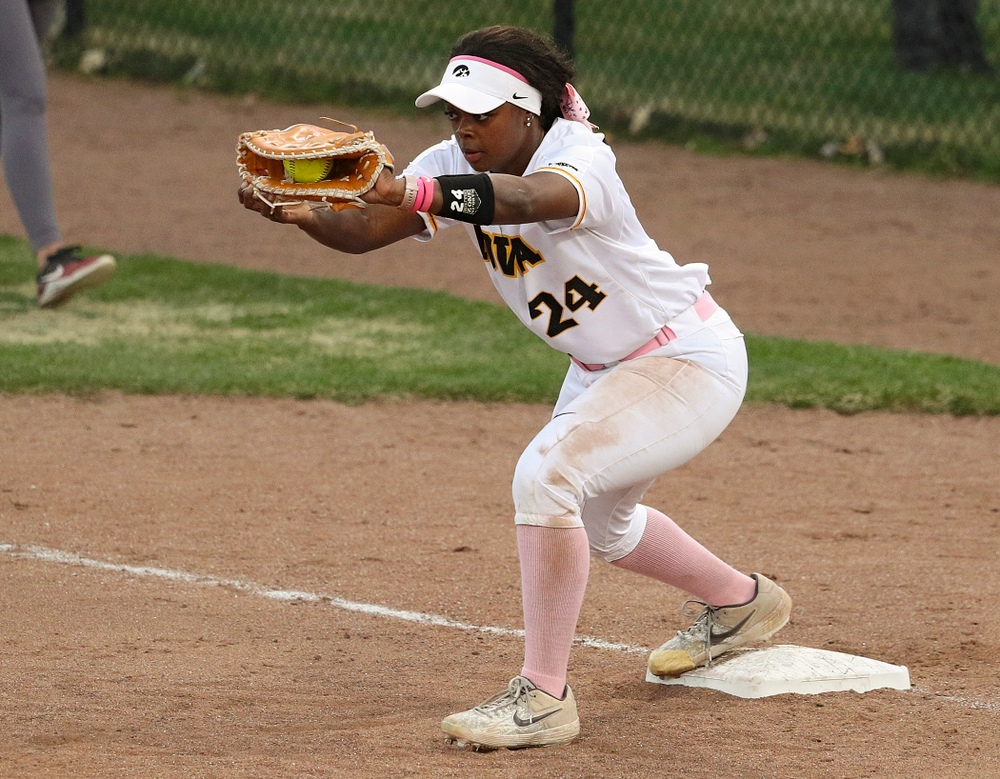 Iowa first baseman DoniRae Mayhew (24) pulls in a throw for an out during the third inning of their game against Iowa State at Pearl Field in Iowa City on Tuesday, Apr. 9, 2019. (Stephen Mally/hawkeyesports.com)
