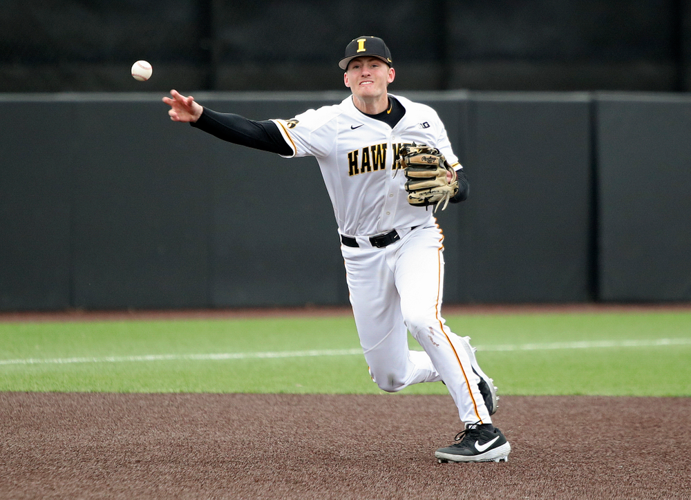 Iowa third baseman Brendan Sher (2) throws to first for an out during the second inning of their college baseball game at Duane Banks Field in Iowa City on Wednesday, March 11, 2020. (Stephen Mally/hawkeyesports.com)