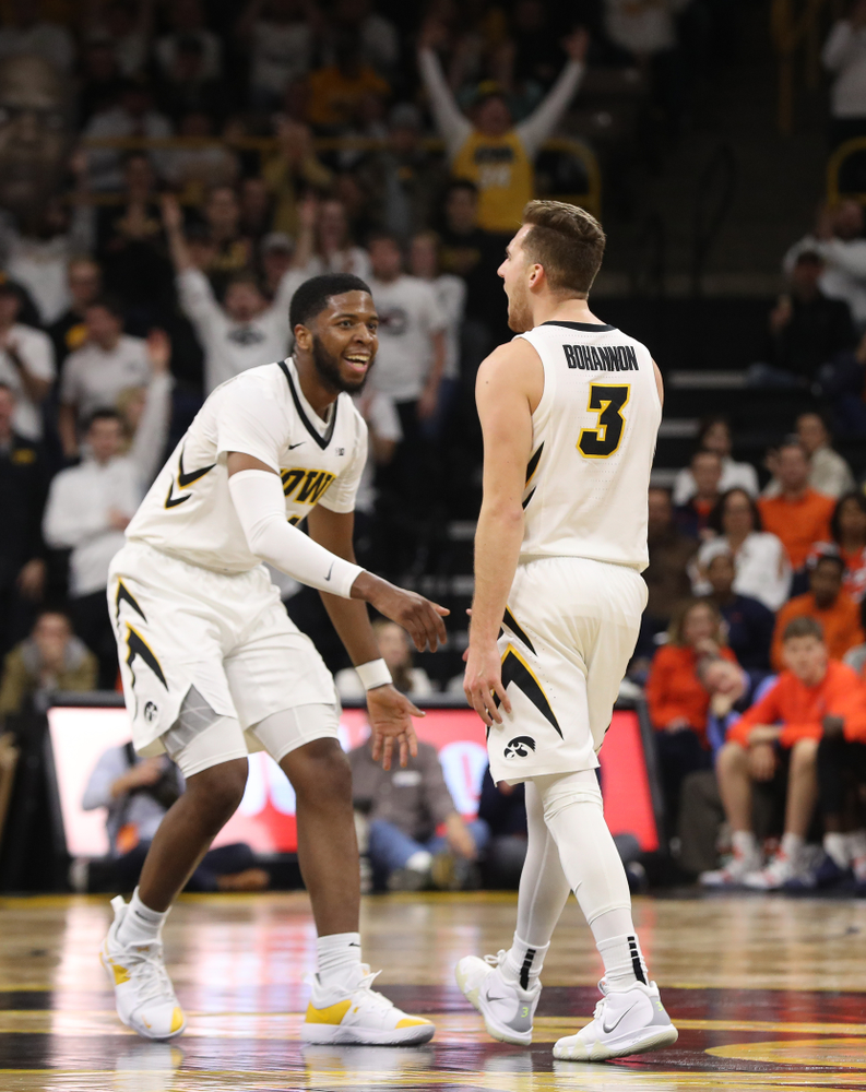 Iowa Hawkeyes guard Isaiah Moss (4) and guard Jordan Bohannon (3) celebrate after a three point basket against the Illinois Fighting Illini Sunday, January 20, 2019 at Carver-Hawkeye Arena. (Brian Ray/hawkeyesports.com)