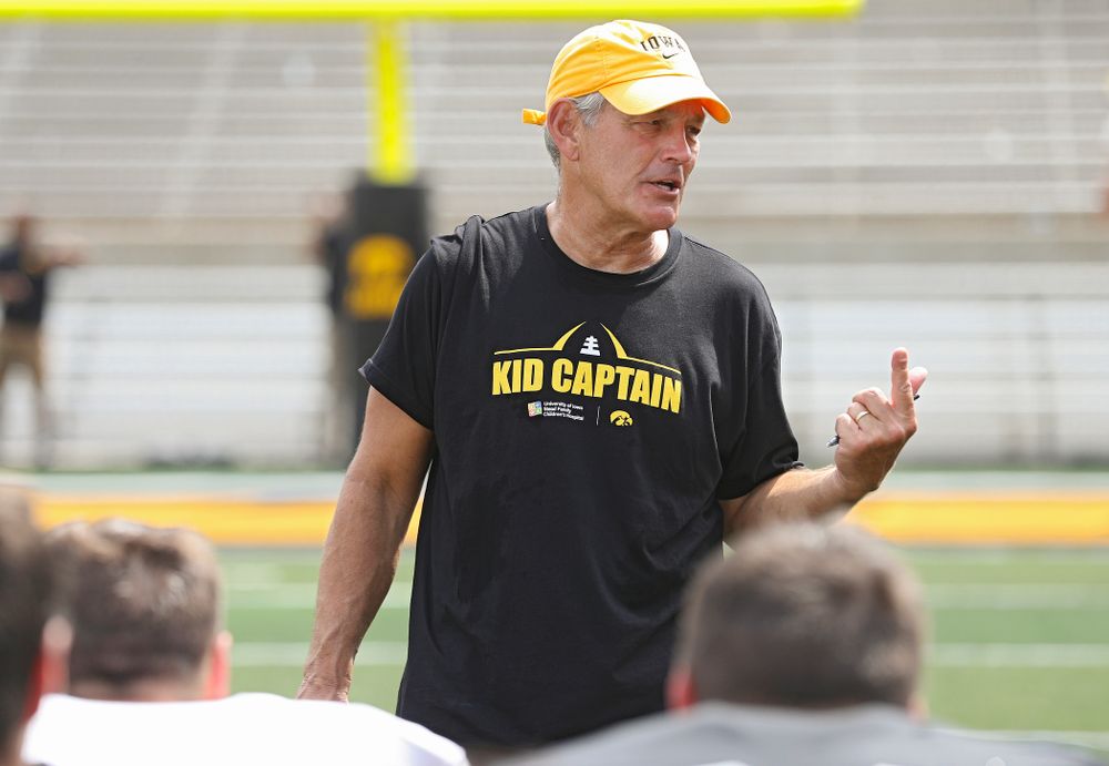 Iowa Hawkeyes head coach Kirk Ferentz talks with his team at the end of Fall Camp Practice No. 8 at Kids Day at Kinnick Stadium in Iowa City on Saturday, Aug 10, 2019. (Stephen Mally/hawkeyesports.com)
