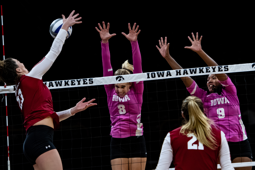 Iowa Hawkeyes right side hitter Reghan Coyle (8) and middle blocker Amiya Jones (9) against the Wisconsin Badgers Saturday, October 6, 2018 at Carver-Hawkeye Arena. (Clem Messerli/Iowa Sports Pictures)