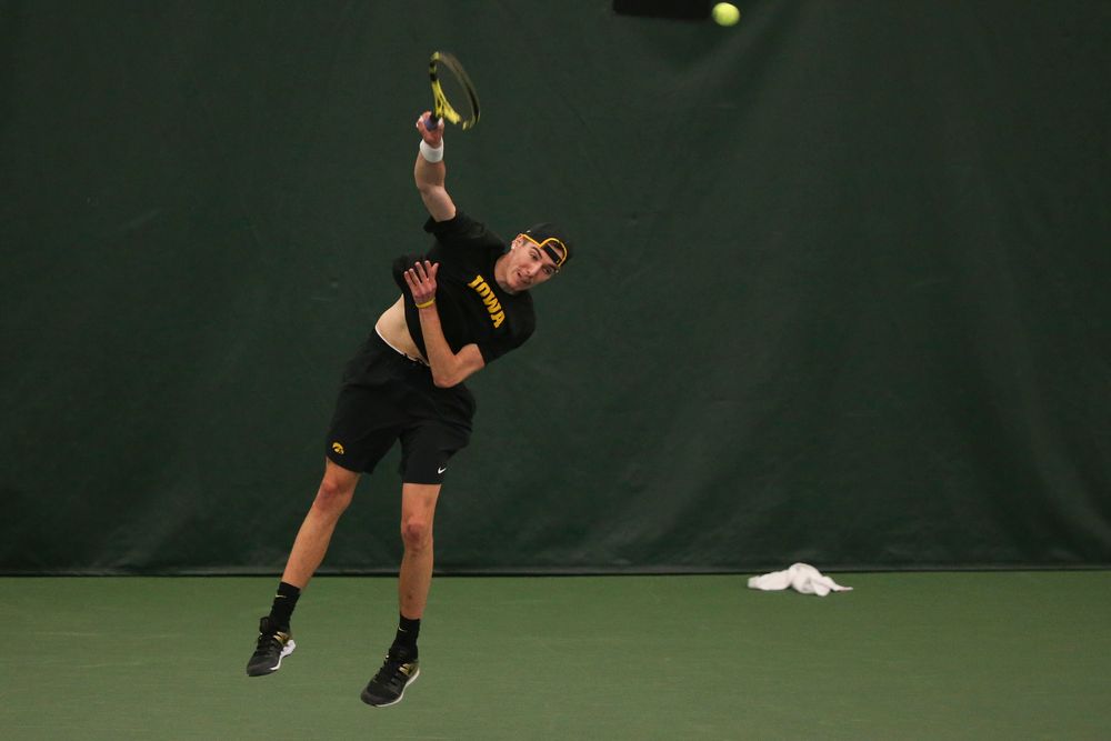 Iowa’s Joe Tyler serves the ball during the Iowa men’s tennis meet vs VCU on Saturday, February 29, 2020 at the Hawkeye Tennis and Recreation Complex. (Lily Smith/hawkeyesports.com)