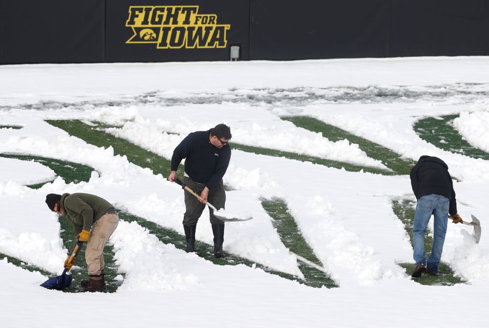 Members of the Iowa Athletics Turf Management staff create the #SnowWave for kids in the Stead Family Children's Hospital Thursday, February