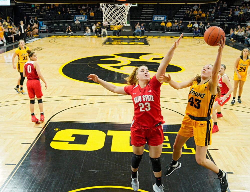 Iowa Hawkeyes forward Amanda Ollinger (43) scores a basket during the first quarter of their game at Carver-Hawkeye Arena in Iowa City on Thursday, January 23, 2020. (Stephen Mally/hawkeyesports.com)