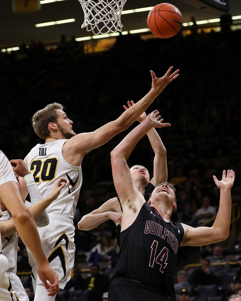 Iowa Hawkeyes forward Riley Till (20) goes up for a rebound during a game against Guilford College at Carver-Hawkeye Arena on November 4, 2018. (Tork Mason/hawkeyesports.com)