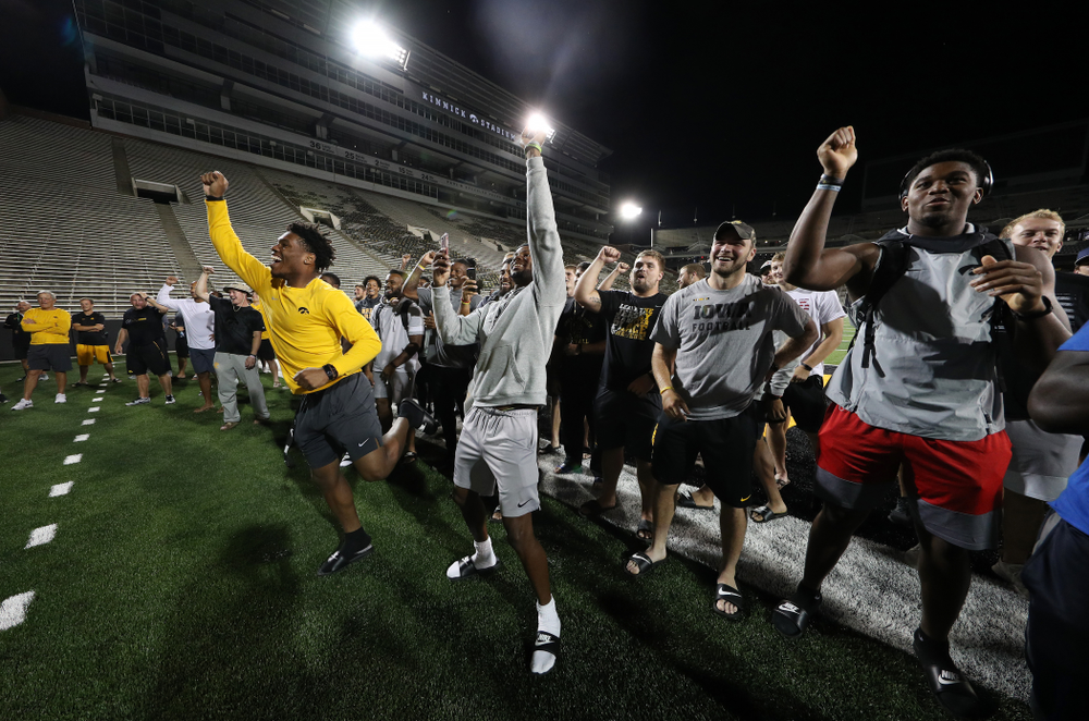 Members o the Iowa Football Team cheer on the new players as they sing the ÒFight SongÓ Thursday, August 22, 2019 at Kinnick Stadium in Iowa City. (Brian Ray/hawkeyesports.com)