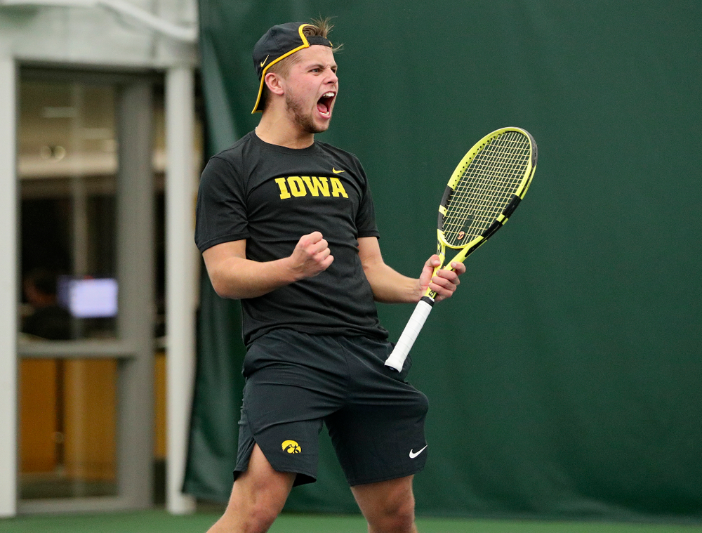 Iowa’s Will Davies celebrates after winning his match at the Hawkeye Tennis and Recreation Complex in Iowa City on Thursday, January 16, 2020. (Stephen Mally/hawkeyesports.com)