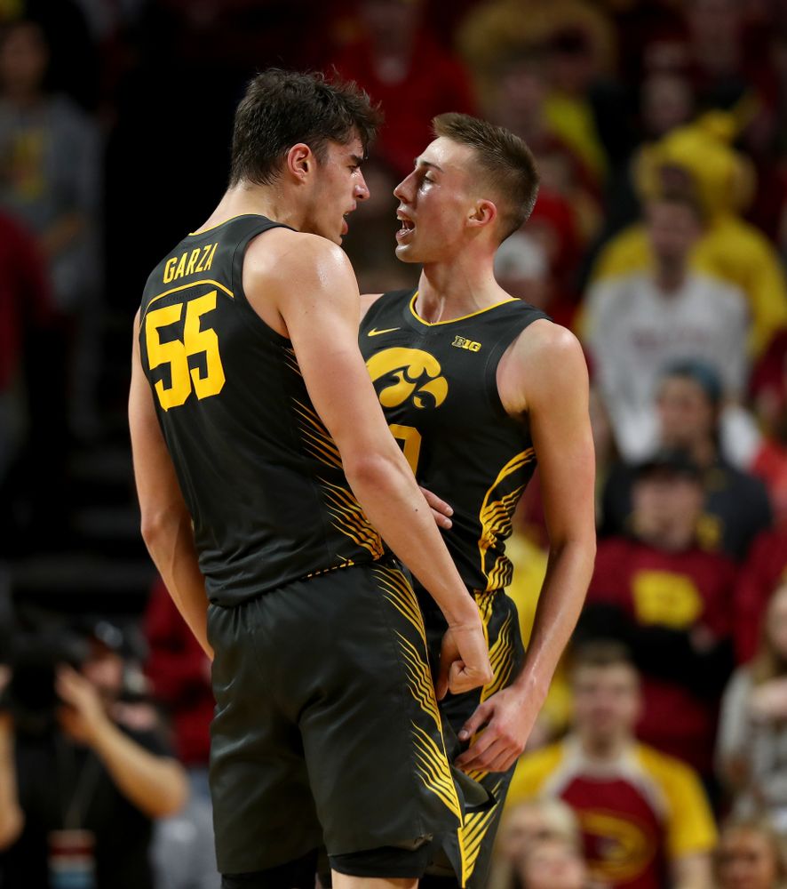 Iowa Hawkeyes forward Luka Garza (55) and guard Joe Wieskamp (10) celebrate during their game against the Iowa State Cyclones Thursday, December 12, 2019 at Hilton Coliseum in Ames, Iowa(Brian Ray/hawkeyesports.com)