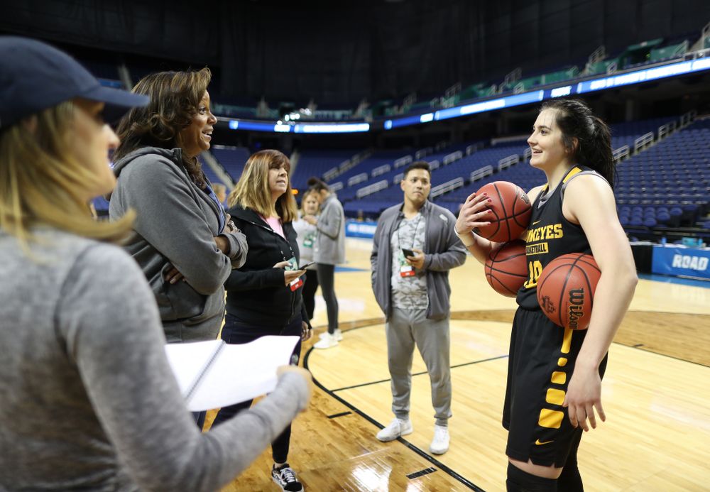 Iowa Hawkeyes forward Megan Gustafson (10) talks with the ESPN Crew following practice for their Sweet 16 matchup against NC State Friday, March 29, 2019 at the Greensboro Coliseum in Greensboro, NC.(Brian Ray/hawkeyesports.com)