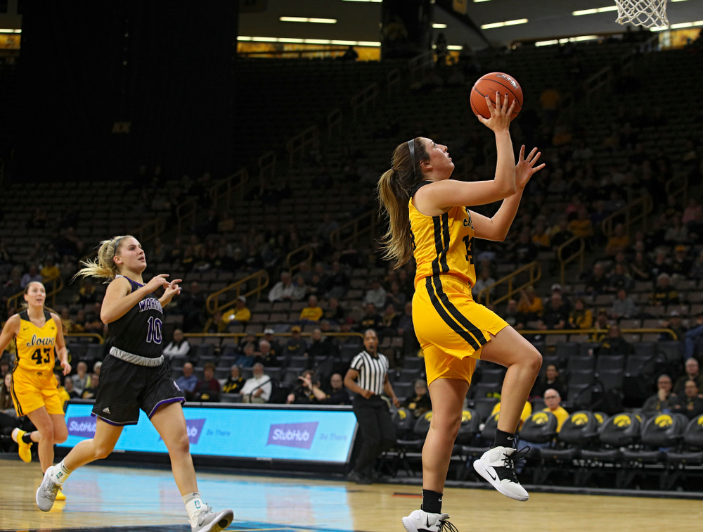 Iowa guard/forward McKenna Warnock (14) makes a basket during the second quarter of their game against Winona State at Carver-Hawkeye Arena in Iowa City on Sunday, Nov 3, 2019. (Stephen Mally/hawkeyesports.com)