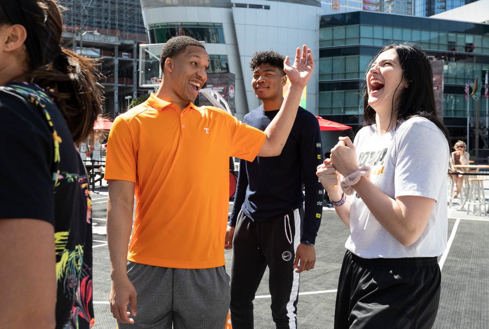 Iowa Hawkeyes forward Megan Gustafson (10) laughs with TennesseeÕs Grant Williams during a Special Olympics Event Friday, April 12, 2019 in the XBOX Plaza at LA Live. (Brian Ray/hawkeyesports.com)